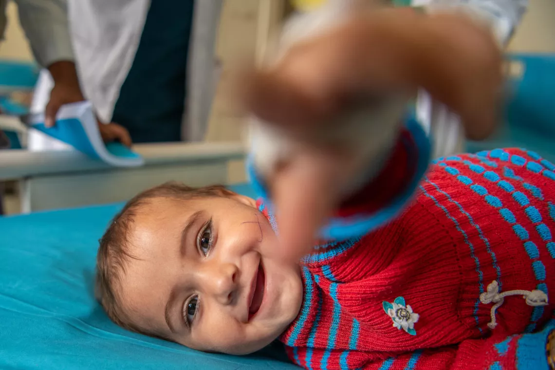 Afghanistan. A child is points toward the camera at the inpatient ward of Wardak Provincial Hospital in Afghanistan.